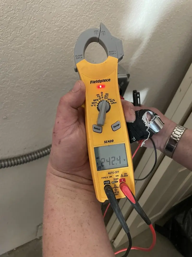 Voltage testing with clamp meter during Electrical Installation Services in Umatilla